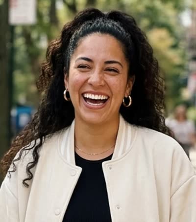 Photo A: a woman with curly dark hair in a cream jacket (AI-generated person)