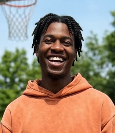 Photo B: a man with short twists in an orange hoodie (AI-generated person)